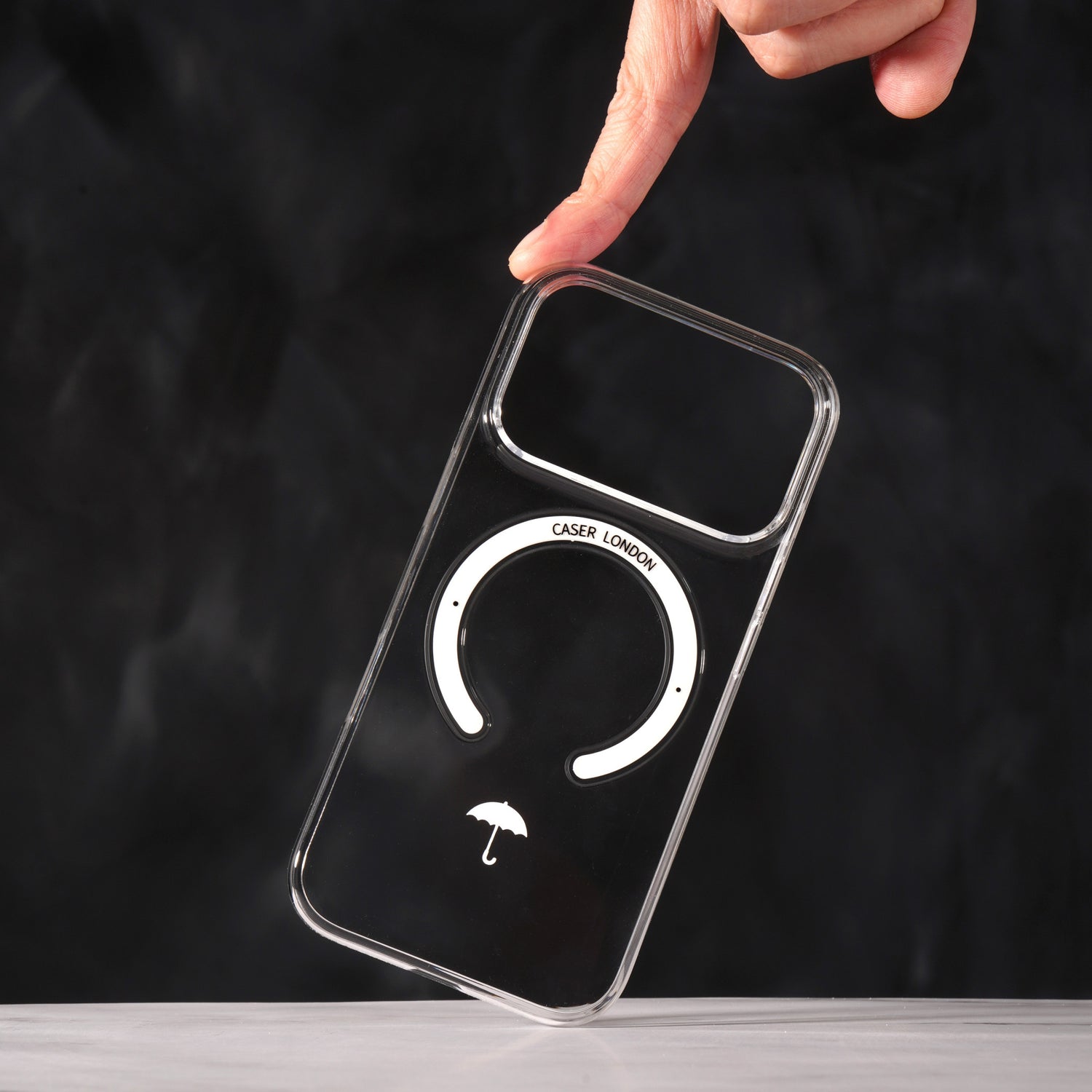 CASER LONDON iPhone 17 Pro case with umbrella icon and white magsafe ring