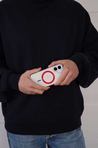 Person holding a iPhone 16 case with Red MagSafe Ring and Big Ben icon
