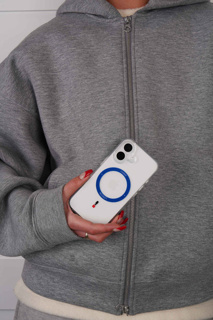 Person holding a iPhone 16 case with Royal Blue MagSafe Ring and Guard icon