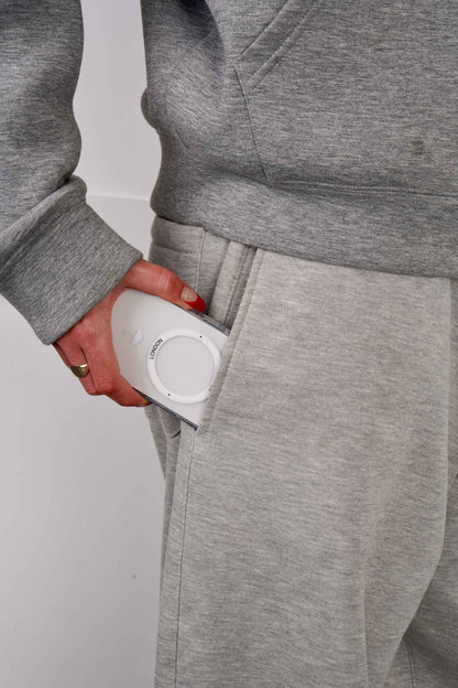 Person holding a iPhone 16 case with White MagSafe Ring and Umbrella icon